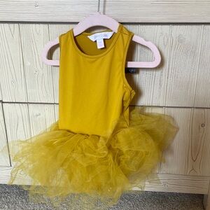 Iloveplum tutu in mustard yellow size 2 years in like new condition.